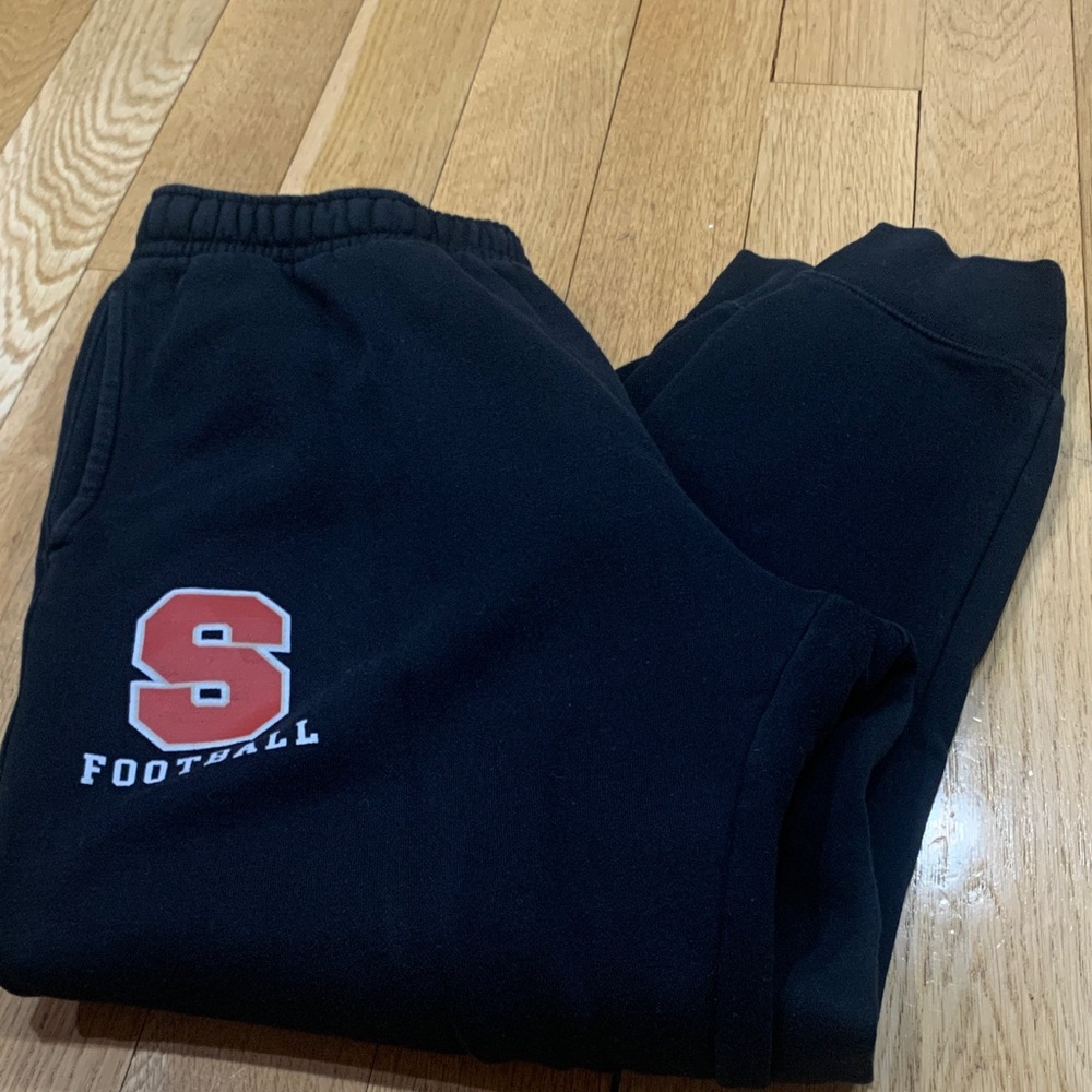 Nike Men Black Sweatpants with White Swoosh and Orange Football Logo